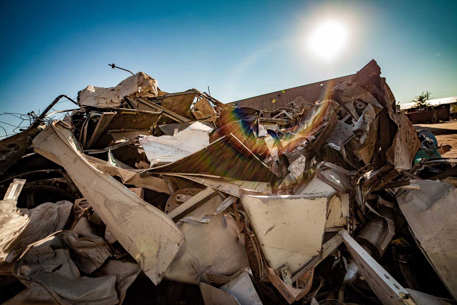 Sunlight hits scrap metal for recycling at the Dem-Con campus