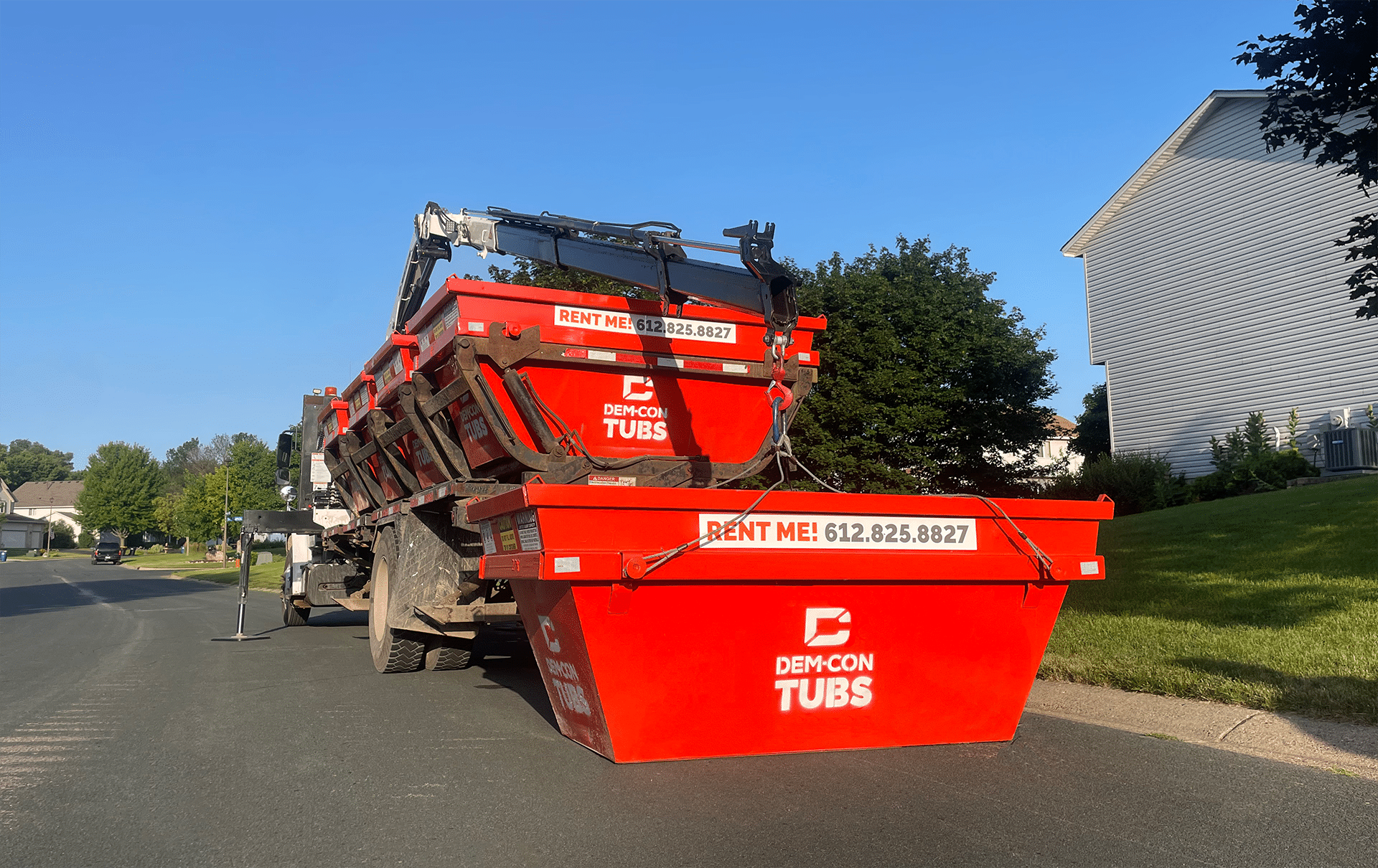 Dem-Con Dumpsters unloading a Tub